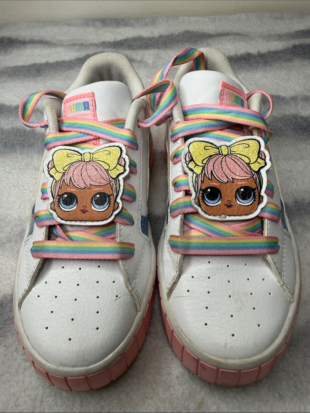 Puma White Kids Sneakers with Pink Trim and Rainbow Laces